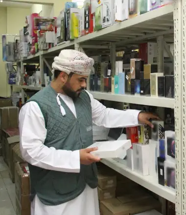 image of a person selling counterfeit and copy of branded perfumes in shop