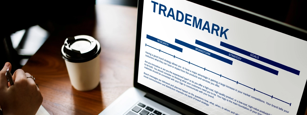 image of a person registering a trademark in the uae on his laptop